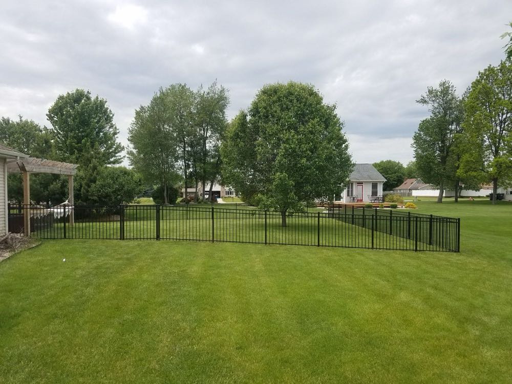 Aluminum fence across a large lawn